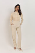 Fitted cream knit cardigan with shaping waist detail and statement tonal buttons.