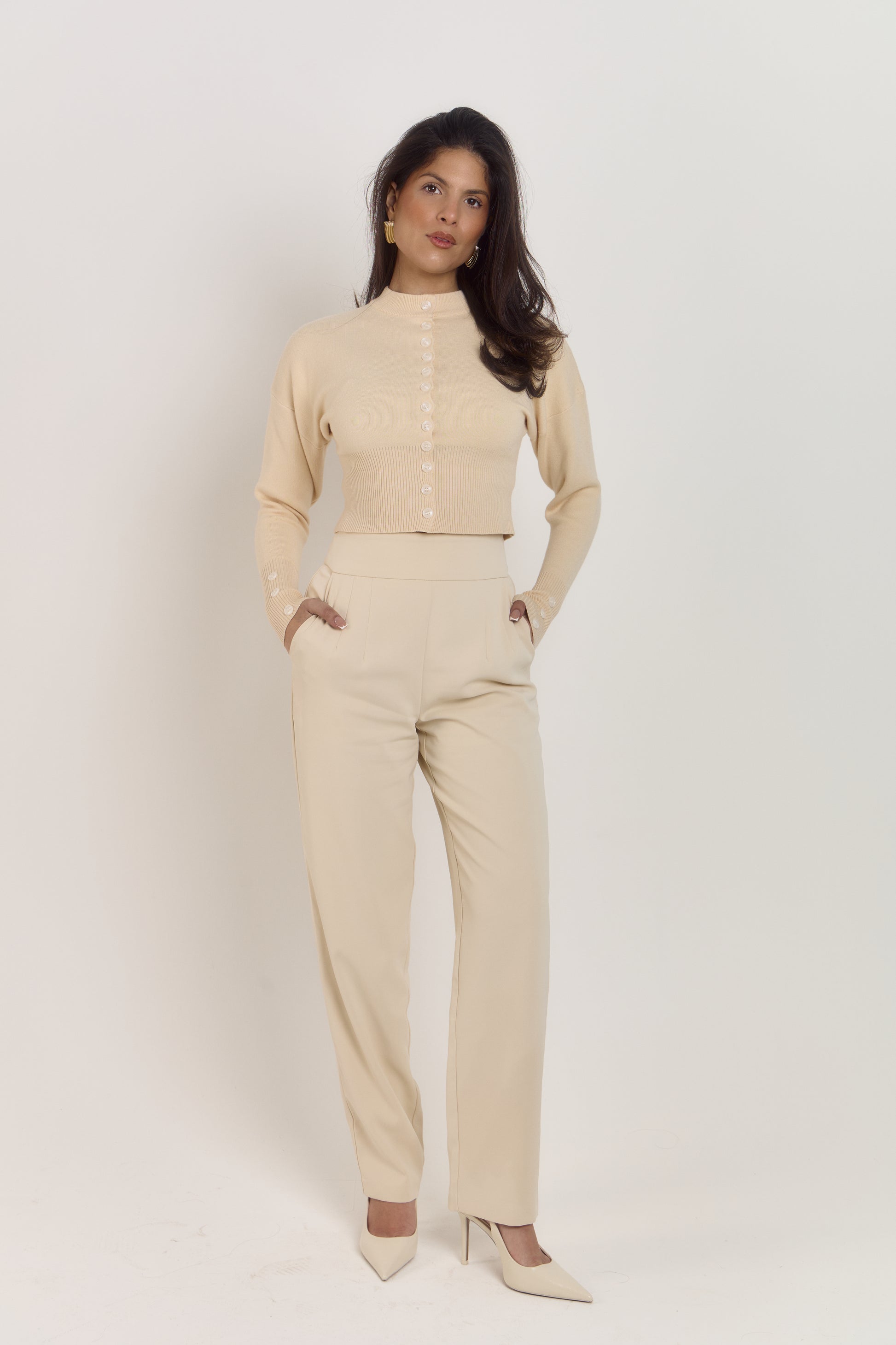 Fitted cream knit cardigan with shaping waist detail and statement tonal buttons.