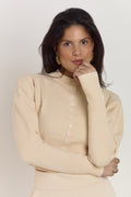 Cream mid length cardigan with shaping silhouette and tapered cuffs.