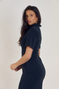 Ardore London Sculpting Short Sleeve Buttoned Knee Length Dress in Midnight Bleu, offering a polished, office-ready look with flattering curved seams, structured collar, and functional pockets for a sleek, professional appearance
