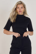 Front view of Ardore London’s Tailoring Sculpted High Neck Top in Classic Noire, featuring a flattering cinched fit, wide sleeves, and premium soft fabric
