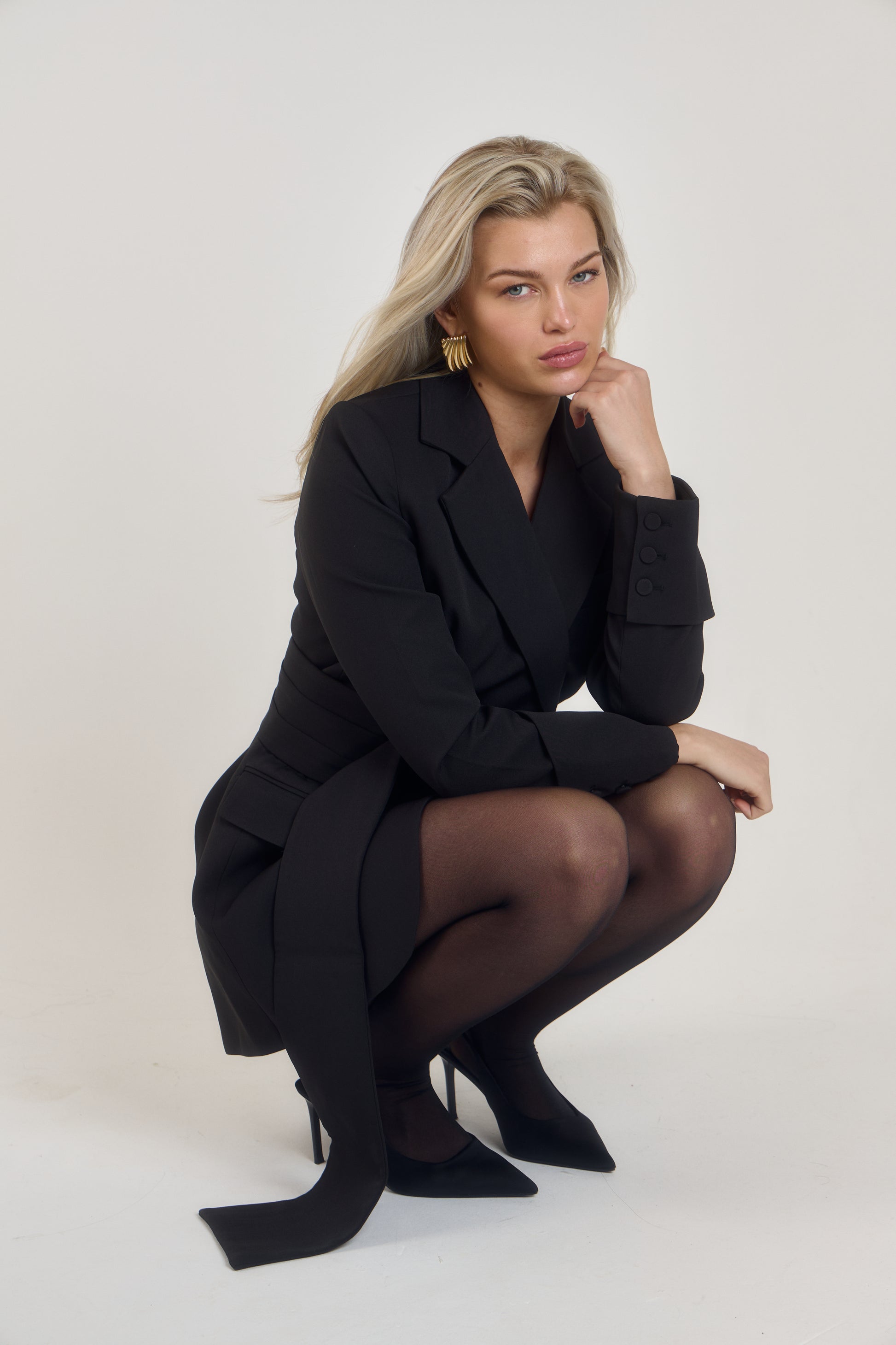 Belted Blazer Dress in Classic Noire by Ardore London, featuring a cinched waist with a tailored belt, structured shoulders, and sharp lapels — a bold and versatile piece perfect for elevated office style and chic evening wear.