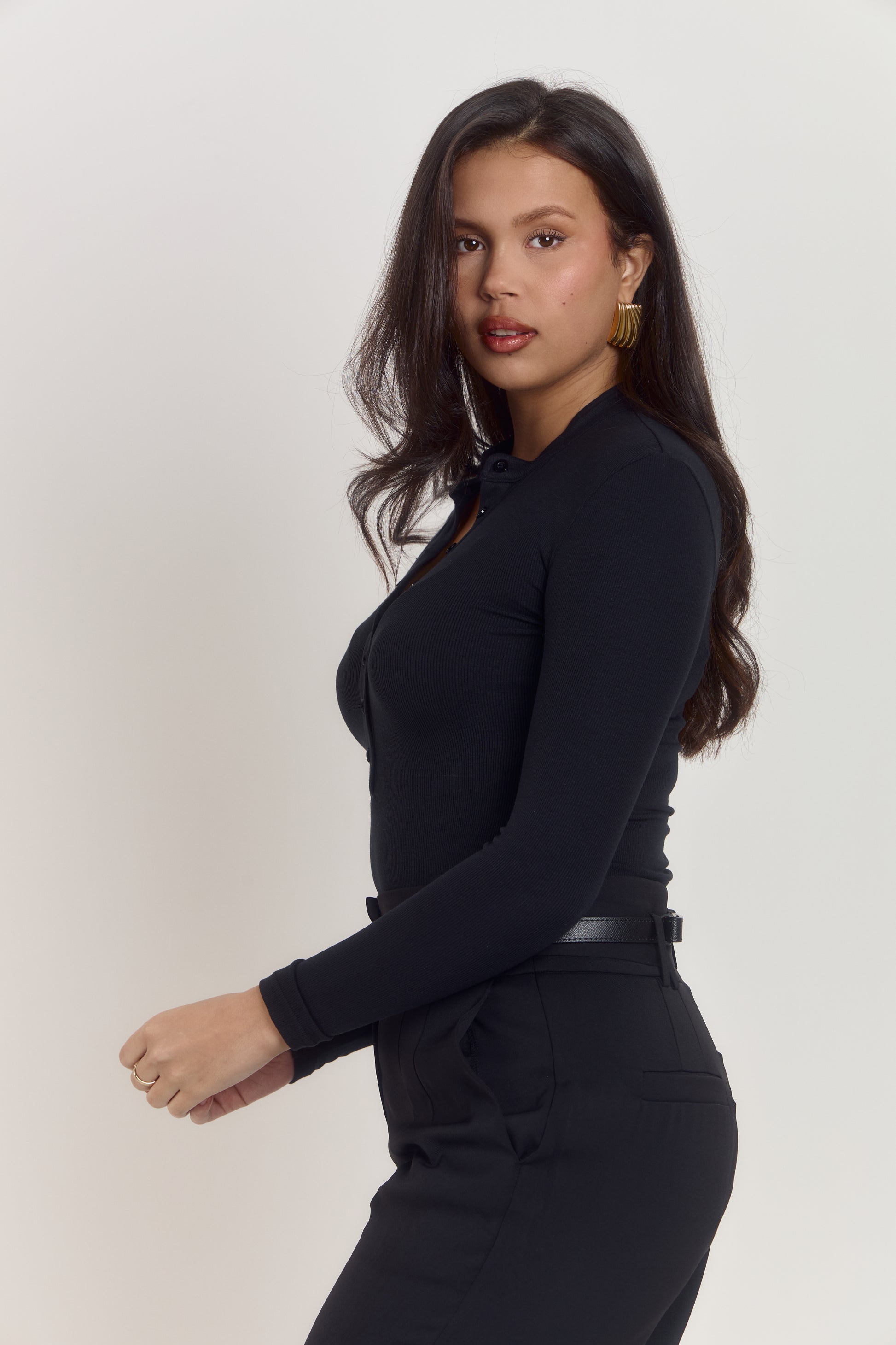 Black cotton rib bodysuit styled for casual and smart casual outfits.