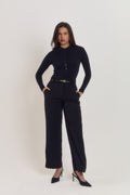 Black cotton ribbed long sleeve bodysuit with pearlised button front and fitted silhouette.