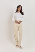 White sculpting shapewear bodysuit with waist compression and smoothing silhouette.