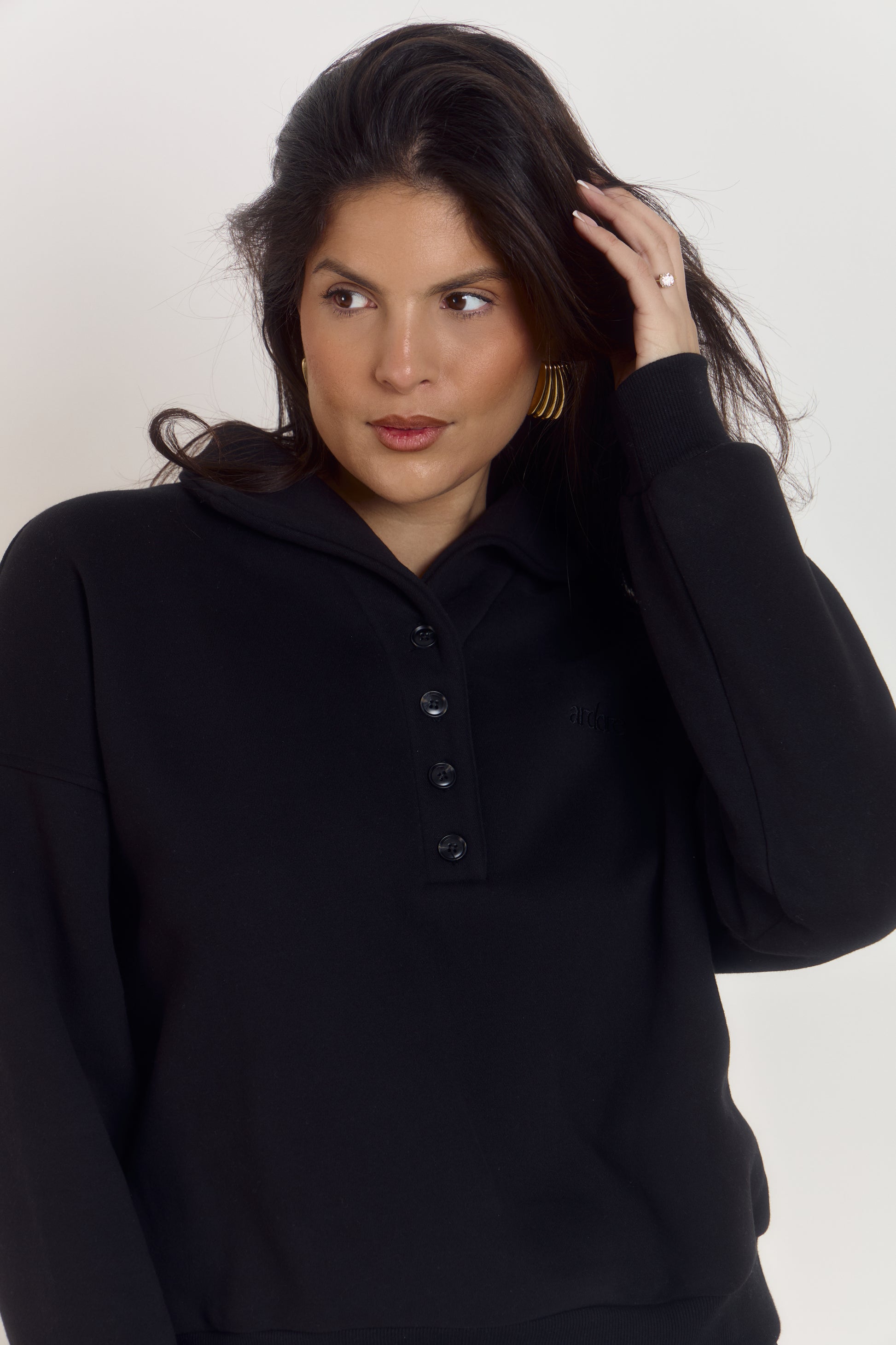 Oversized heavyweight cotton black sweater with collared neckline styled up and signature Ardore embroidered logo.