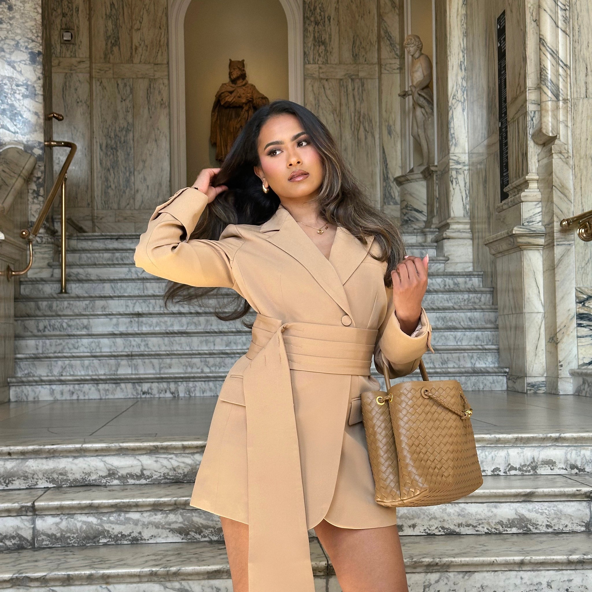 Close-up front view of the Signature Oversized Belted Blazer Dress in Caramel Crème by Ardore London, showcasing the tailored belt cinching the waist, soft caramel fabric texture, and structured lapels — perfect for chic office and evening wear.