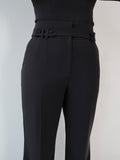 Close-up front view of black tailoring belted wide leg trousers in Classic Noire by Ardore London, showcasing the high-waist belt detail, premium fabric texture, and expert tailoring.