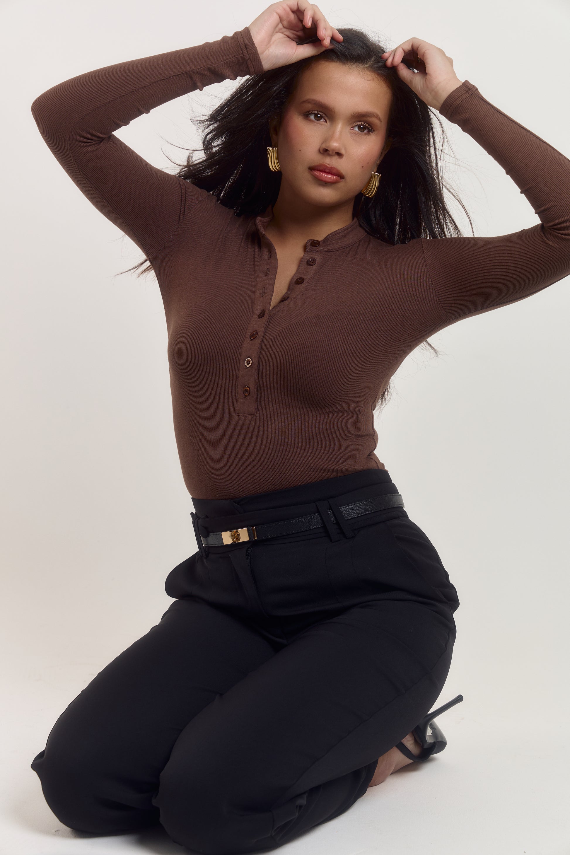 Breathable cotton ribbed brown bodysuit with elegant button front detail.
