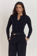 Black long sleeve cotton bodysuit with pearlised buttons and smooth silhouette.