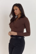 Cocoa cotton long sleeve bodysuit with pearlised buttons and smooth silhouette.