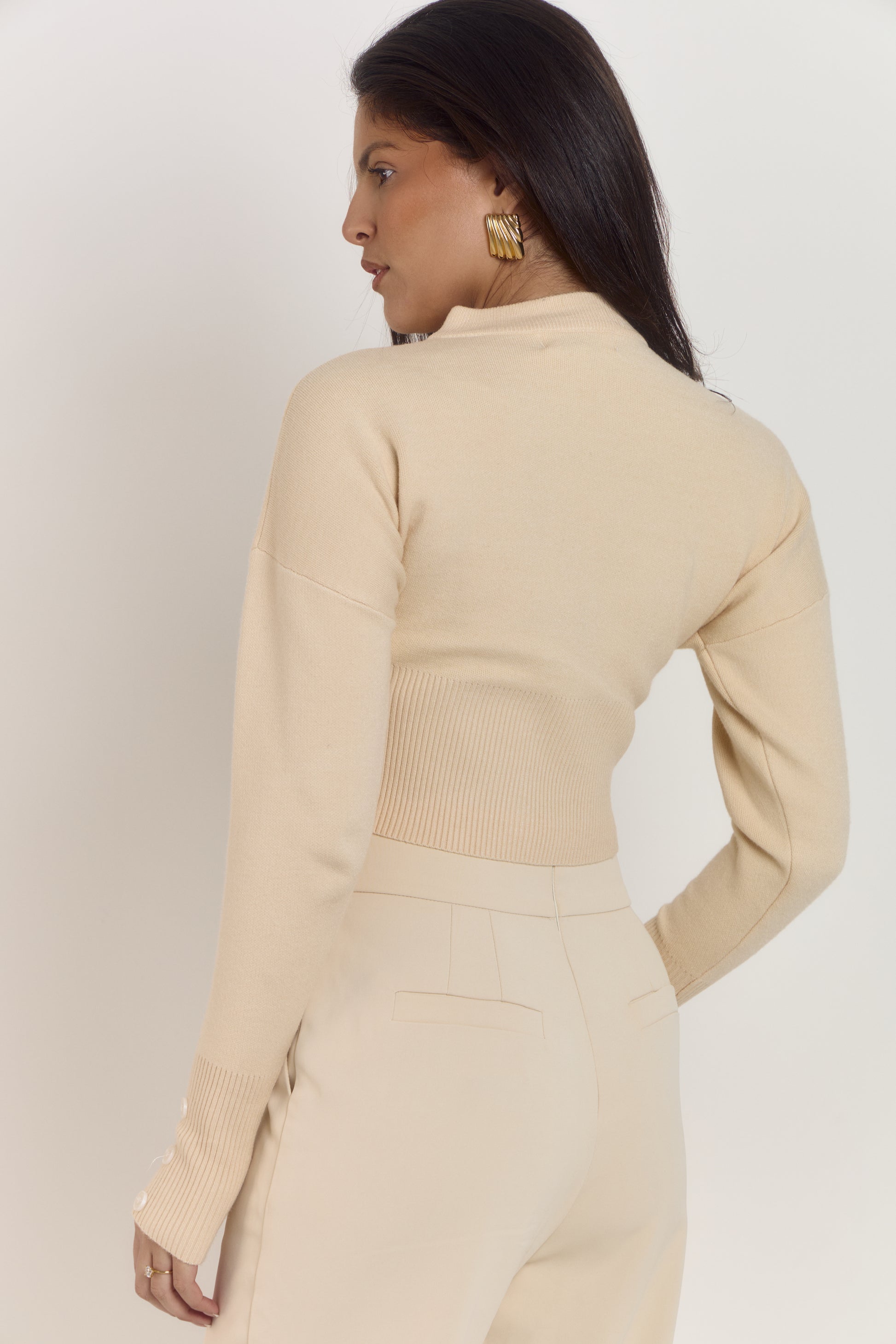 Waist contouring cream cardigan with soft cosy fabric and sculpted fit.