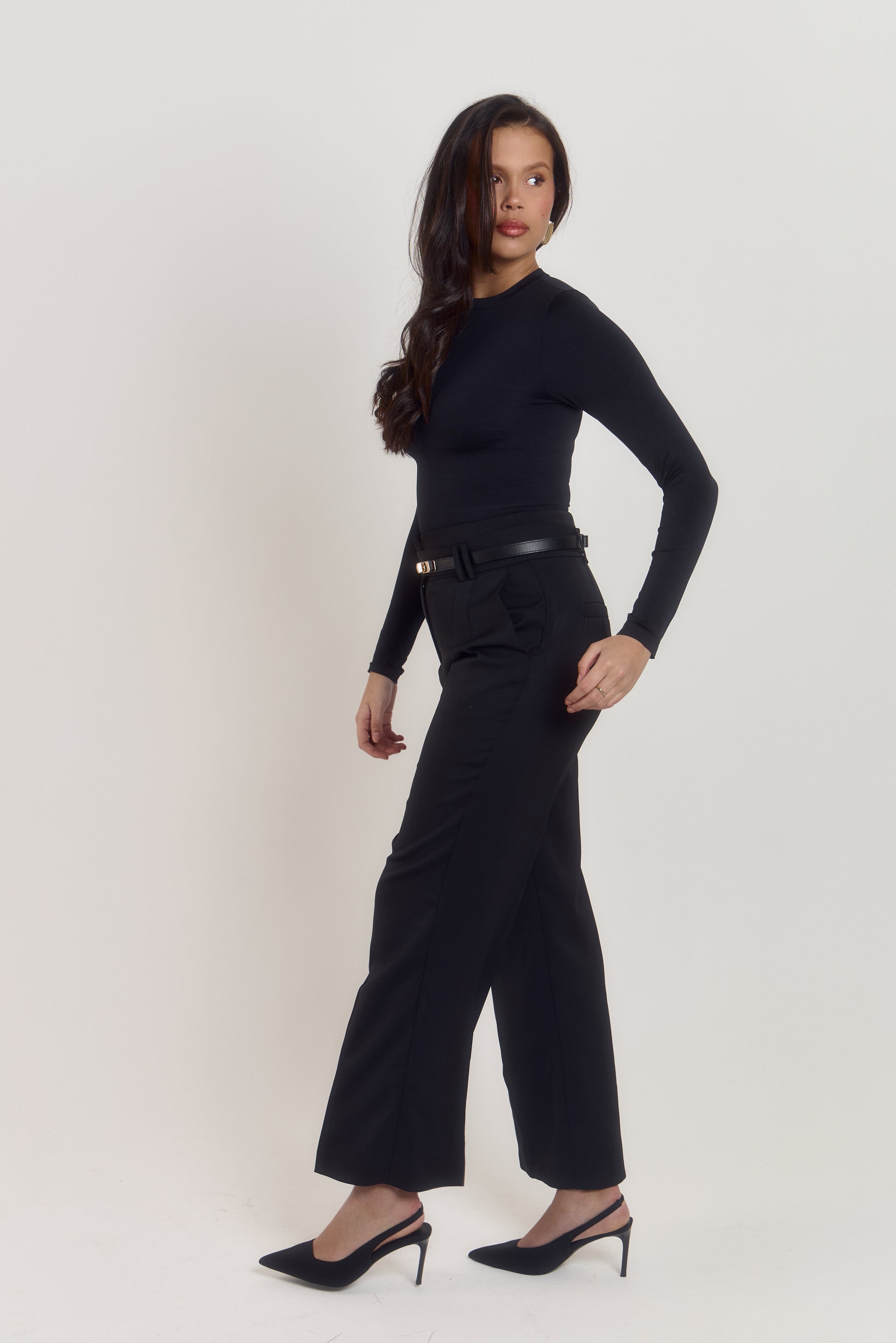 Women’s fitted black shapewear bodysuit with targeted waist compression and polished rounded neckline.