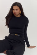 Structured black contour bodysuit with smoothing midsection panel and refined minimalist finish.