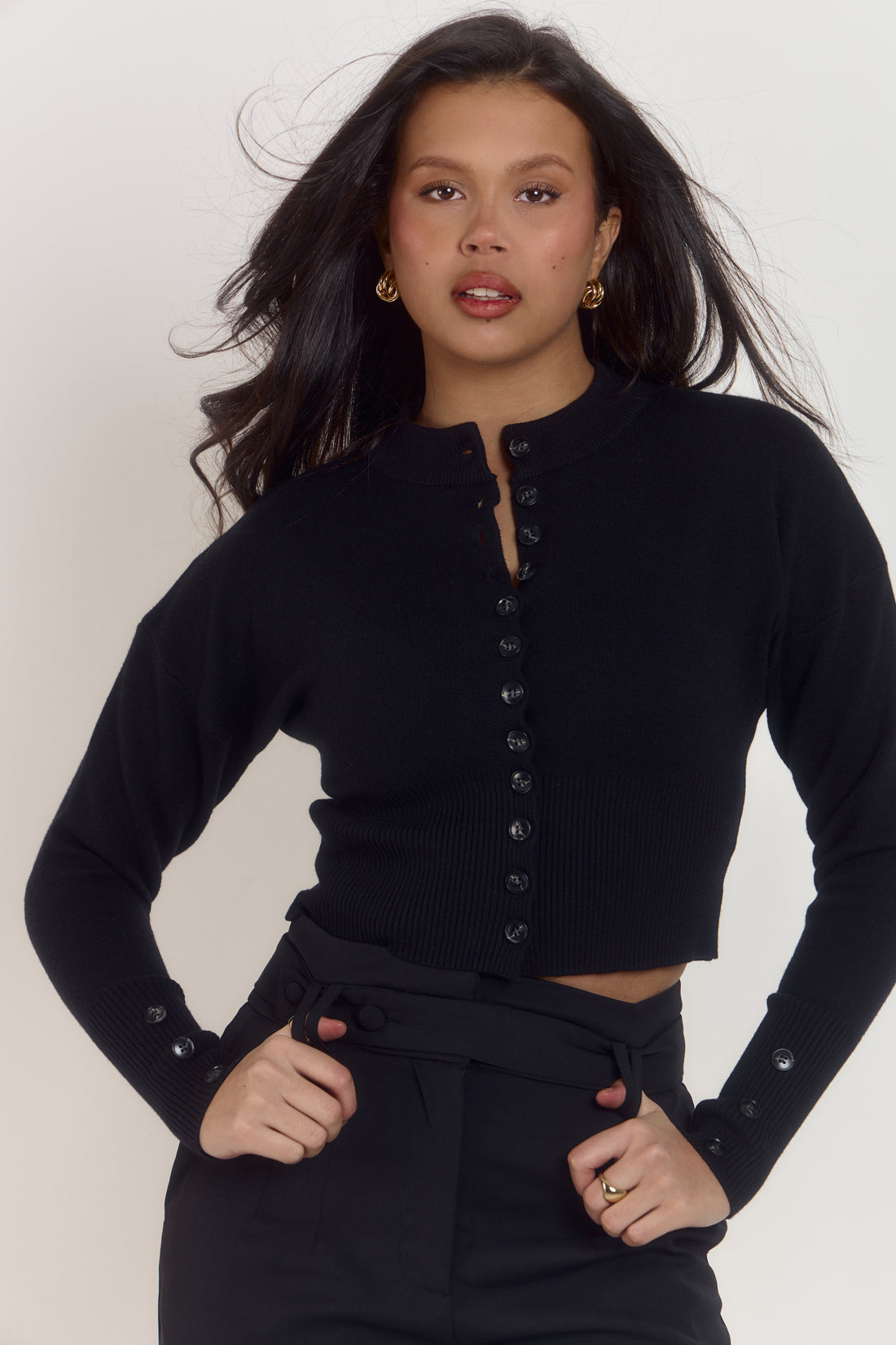 Women’s classic noir fitted cardigan with waist defining silhouette and functional anti-gape button placement.