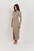 Structured taupe pinstripe polo top paired with coordinating tailored midi skirt, chic corporate outfit.