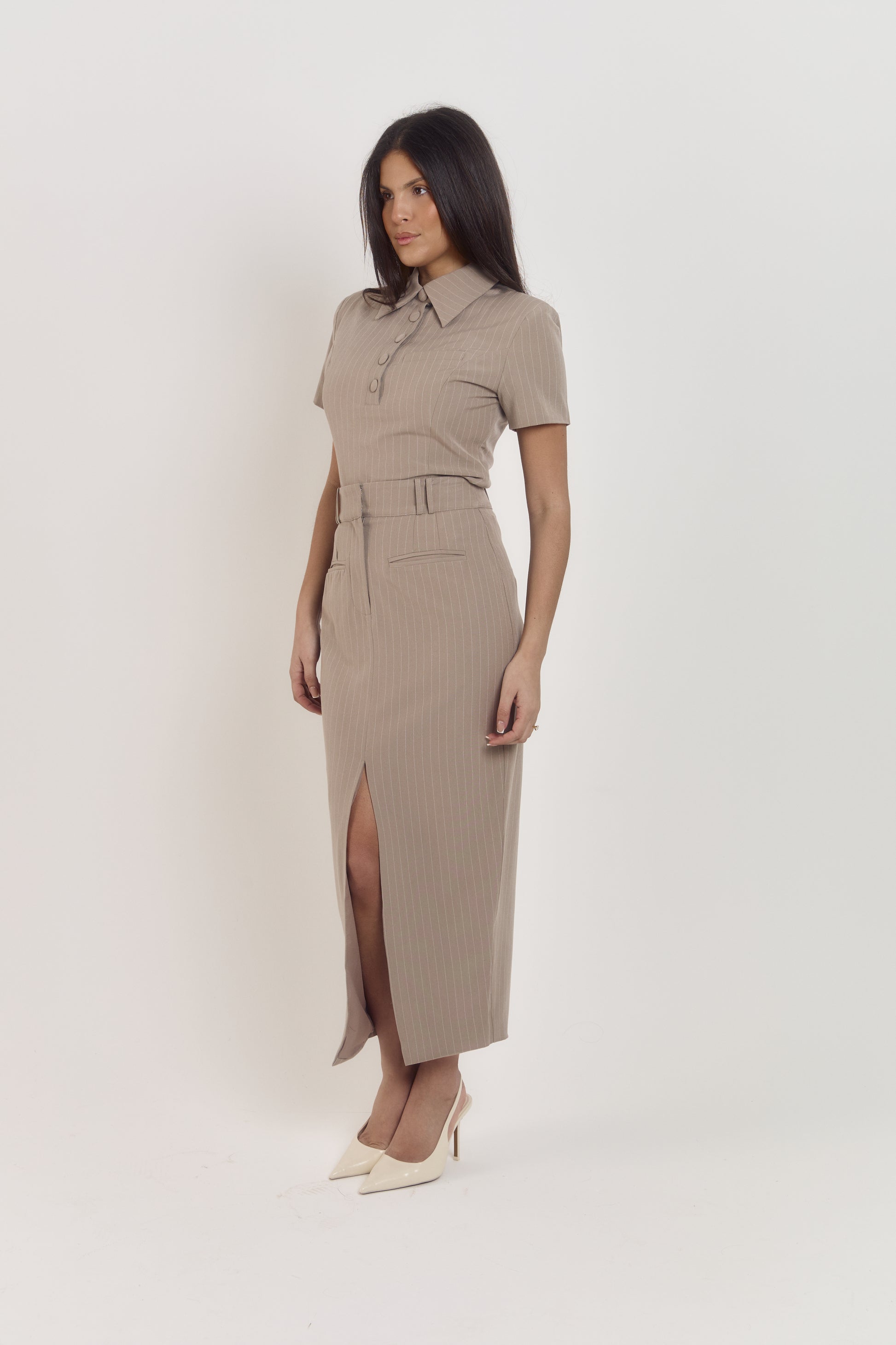 Structured taupe pinstripe polo top paired with coordinating tailored midi skirt, chic corporate outfit.