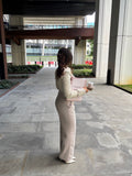 Tailoring belted wide leg trousers in chai latté by Ardore London, featuring a high-waist fit, wide-leg silhouette, and elegant tailoring for a sophisticated look.