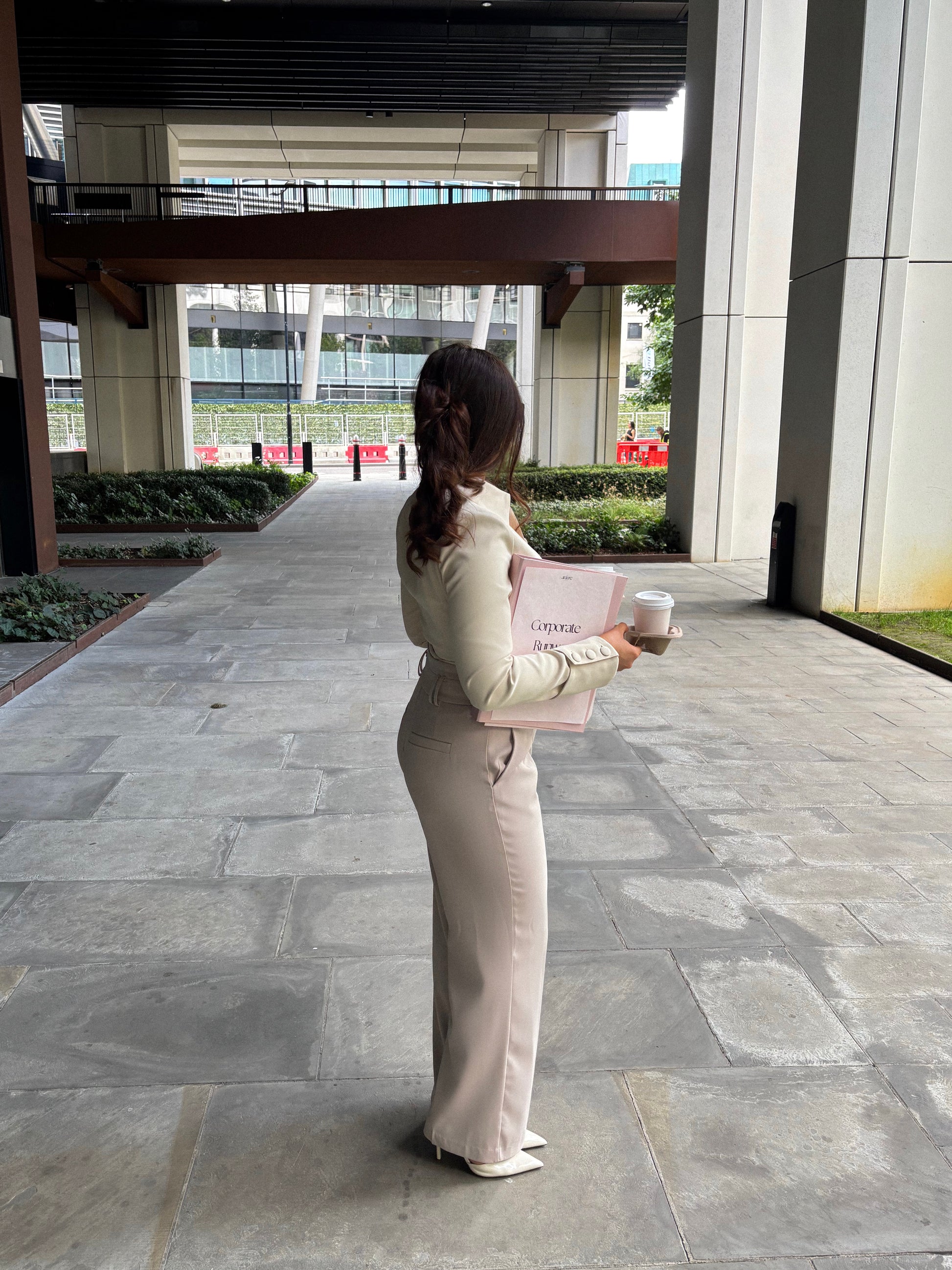 Tailoring belted wide leg trousers in chai latté by Ardore London, featuring a high-waist fit, wide-leg silhouette, and elegant tailoring for a sophisticated look.