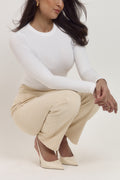 Premium white sculpting shapewear bodysuit with refined minimal finish.
