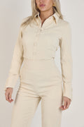 Full view of Ardore London Vanilla Crème structured long sleeve sculpted blouse paired with cream trousers, offering a chic city look with sculpted tailoring, signature triple-button cuffs, exaggerated collar, and luxurious fabric—perfect for office elegance and sophisticated day-to-night style.