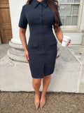 Close-up of Ardore London Sculpting Short Sleeve Buttoned Knee Length Dress in Midnight Bleu, featuring a sophisticated structured collar, flattering curved seams, and functional buttons, designed for a timeless, polished office look.