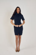 Ardore London Sculpting Short Sleeve Buttoned Knee Length Dress in Midnight Bleu, offering a polished, office-ready look with flattering curved seams, structured collar, and functional pockets for a sleek, professional appearance