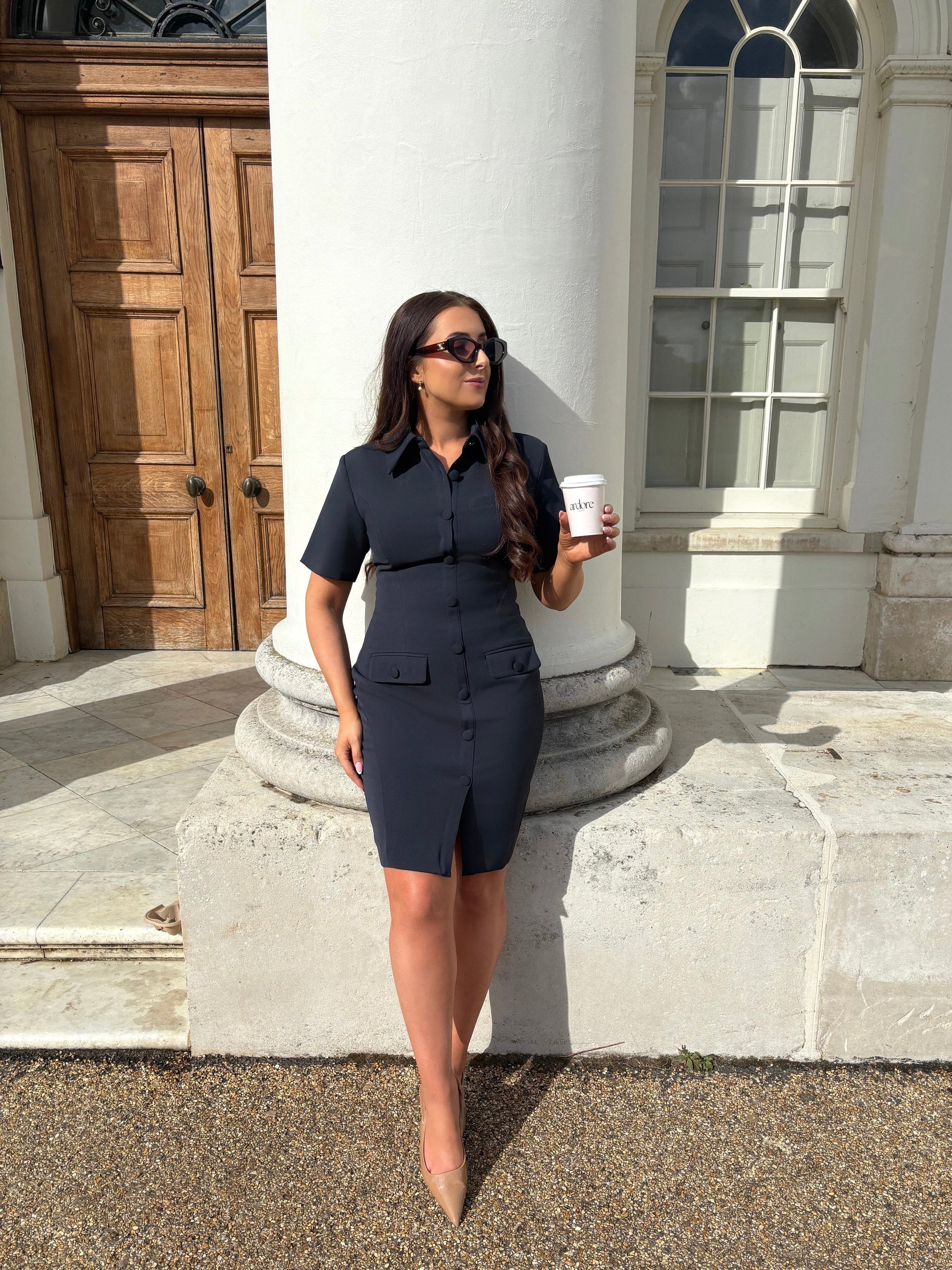 Full front view of Ardore London Sculpting Short Sleeve Buttoned Knee Length Dress in Midnight Bleu, offering a polished, office-ready look with flattering curved seams, structured collar, and functional pockets for a sleek, professional appearance.