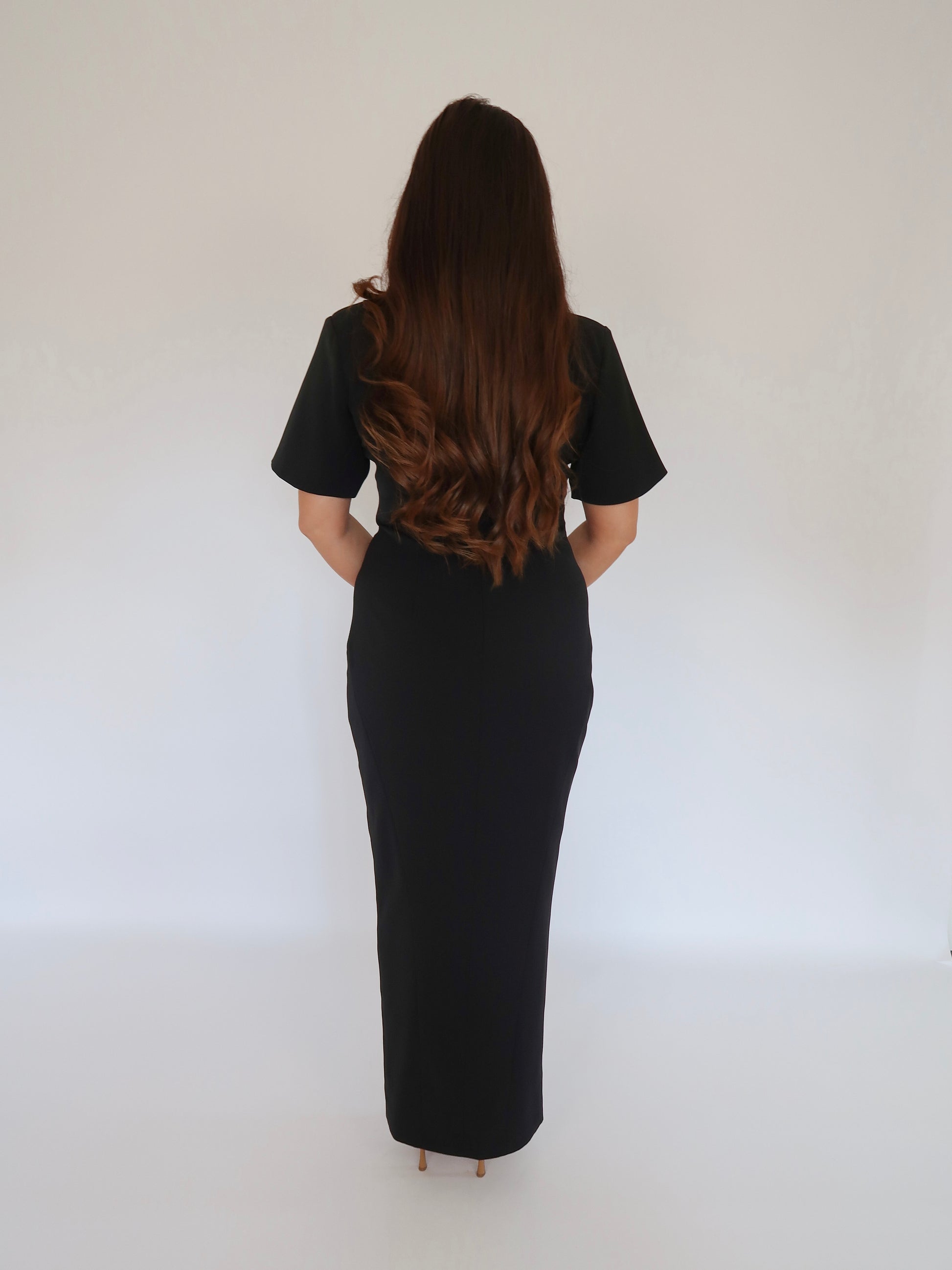 Back view of Ardore London Sculpting Short Sleeve Buttoned Maxi Dress in Classic Noire, featuring the elegant structured silhouette, long back zip, and fully lined design for a smooth, chic look.
