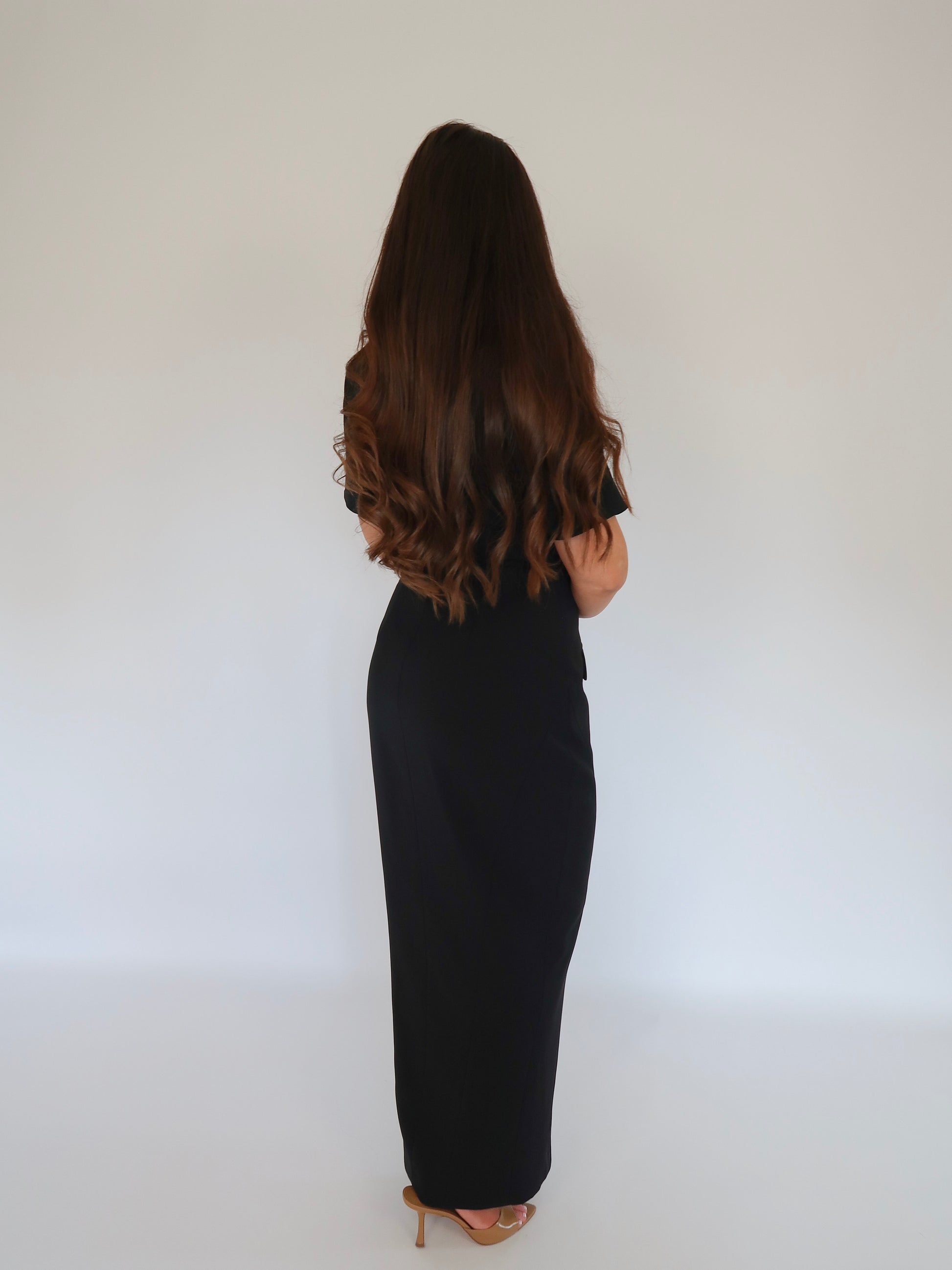 Back view of Ardore London Sculpting Short Sleeve Buttoned Maxi Dress in Classic Noire, featuring the elegant structured silhouette, long back zip, and fully lined design for a smooth, chic look.