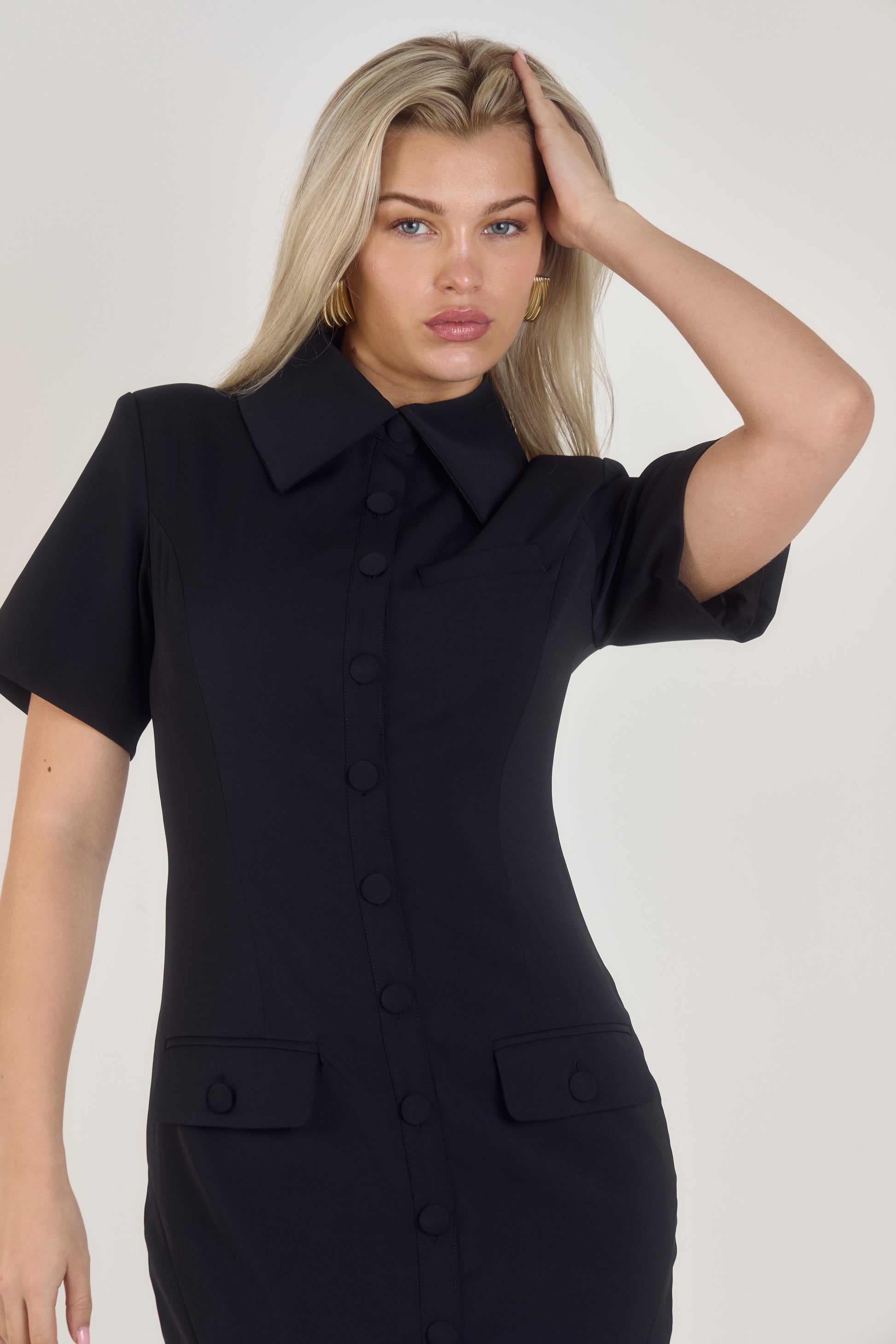 Full front view of Ardore London Sculpting Short Sleeve Buttoned Maxi Dress in Classic Noire, showcasing the chic, structured silhouette, signature curved seams, fabric-covered buttons, and exaggerated collar for a timeless, flattering look.