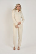 Ardore London Vanilla Crème structured long sleeve sculpted blouse paired with cream trousers, featuring sculpted tailoring, signature triple-button cuffs, exaggerated collar, and soft, luxurious fabric for an elevated, chic look.