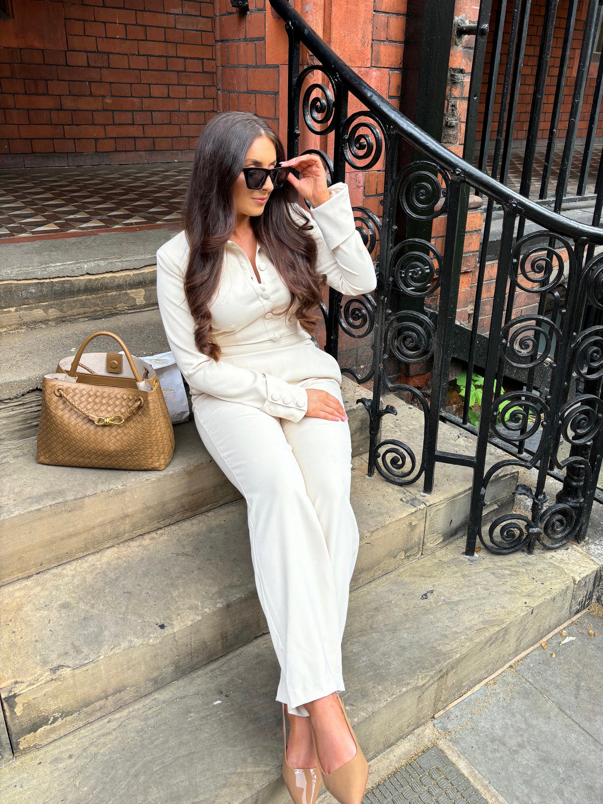 Full view of Ardore London Vanilla Crème structured long sleeve sculpted blouse paired with cream trousers, offering a chic city look with sculpted tailoring, signature triple-button cuffs, exaggerated collar, and luxurious fabric—perfect for office elegance and sophisticated day-to-night style.