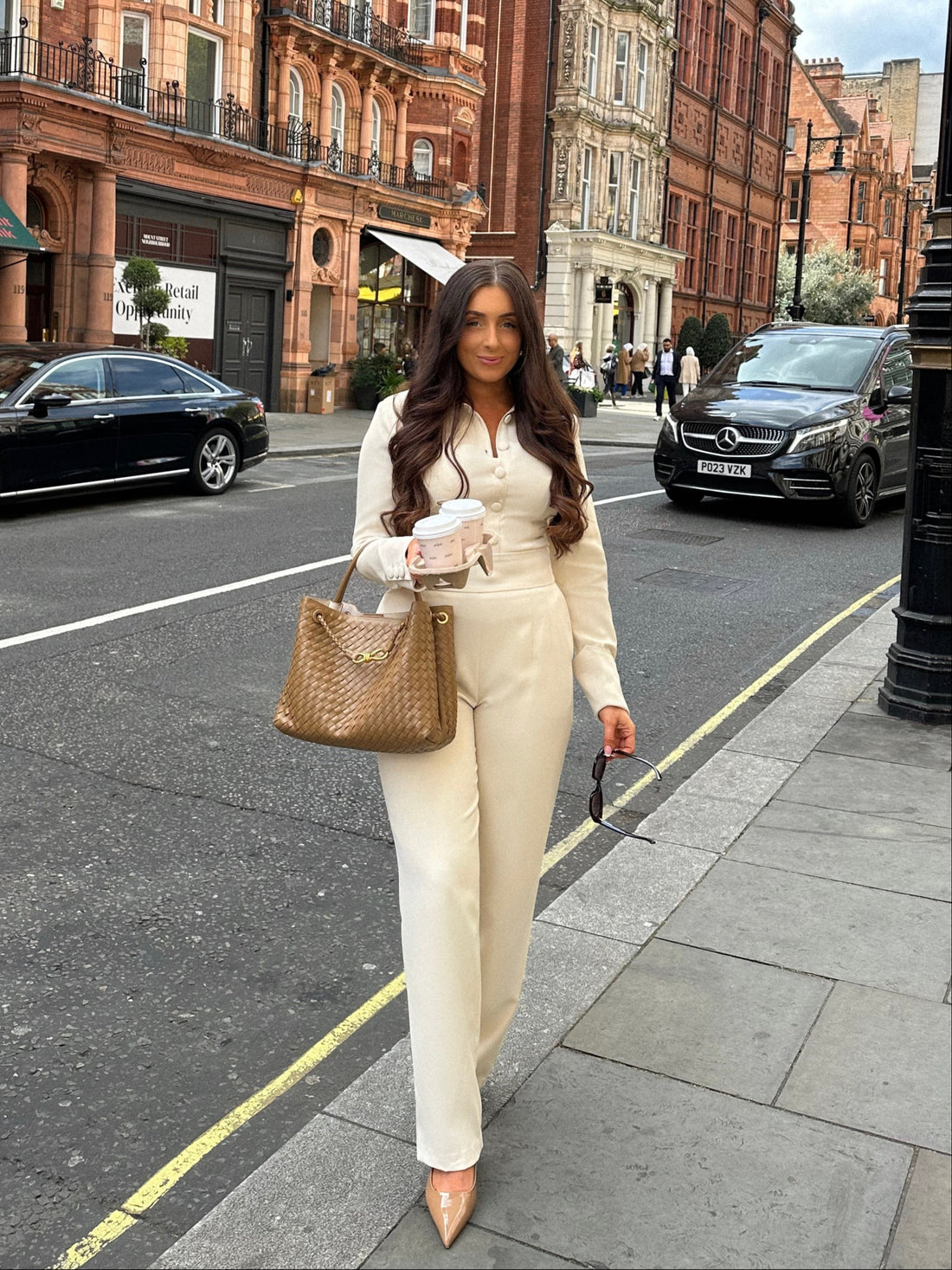 Full view of Ardore London Vanilla Crème structured long sleeve sculpted blouse paired with cream trousers, offering a chic city look with sculpted tailoring, signature triple-button cuffs, exaggerated collar, and luxurious fabric—perfect for office elegance and sophisticated day-to-night style.
