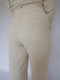 Back close-up of Ardore London Vanilla Crème high-waisted straight leg trousers, showcasing the sculpting fit, flattering high waist, and invisible back zip for a seamless, polished look.