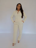 Full front view of Ardore London Vanilla Crème high-waisted straight leg trousers, featuring a sleek, sculpted fit, flattering high waist, and practical side pockets for an elegant, refined look.