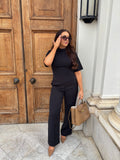 Front view of Ardore London’s Tailoring Sculpted High Neck Top in Classic Noire, featuring a flattering cinched fit, wide sleeves, and premium soft fabric