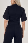 Back view of Ardore London’s Tailoring Sculpted High Neck Top in Classic Noire, featuring a flattering cinched fit, wide sleeves, and premium soft fabric